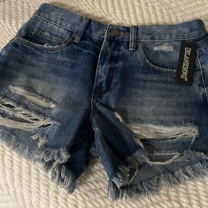 Distressed mid rise denim shorts